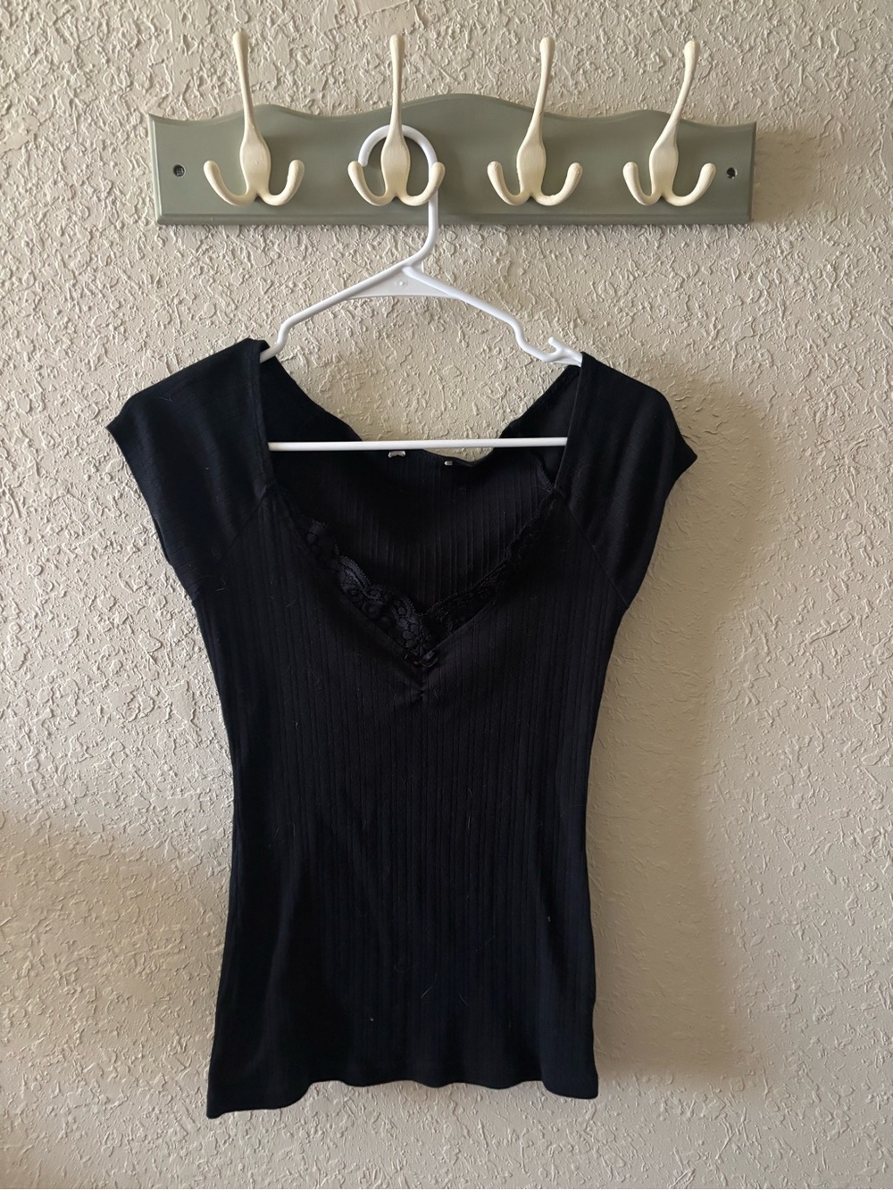 Women's Black V-Neck Top with Lace Trim.